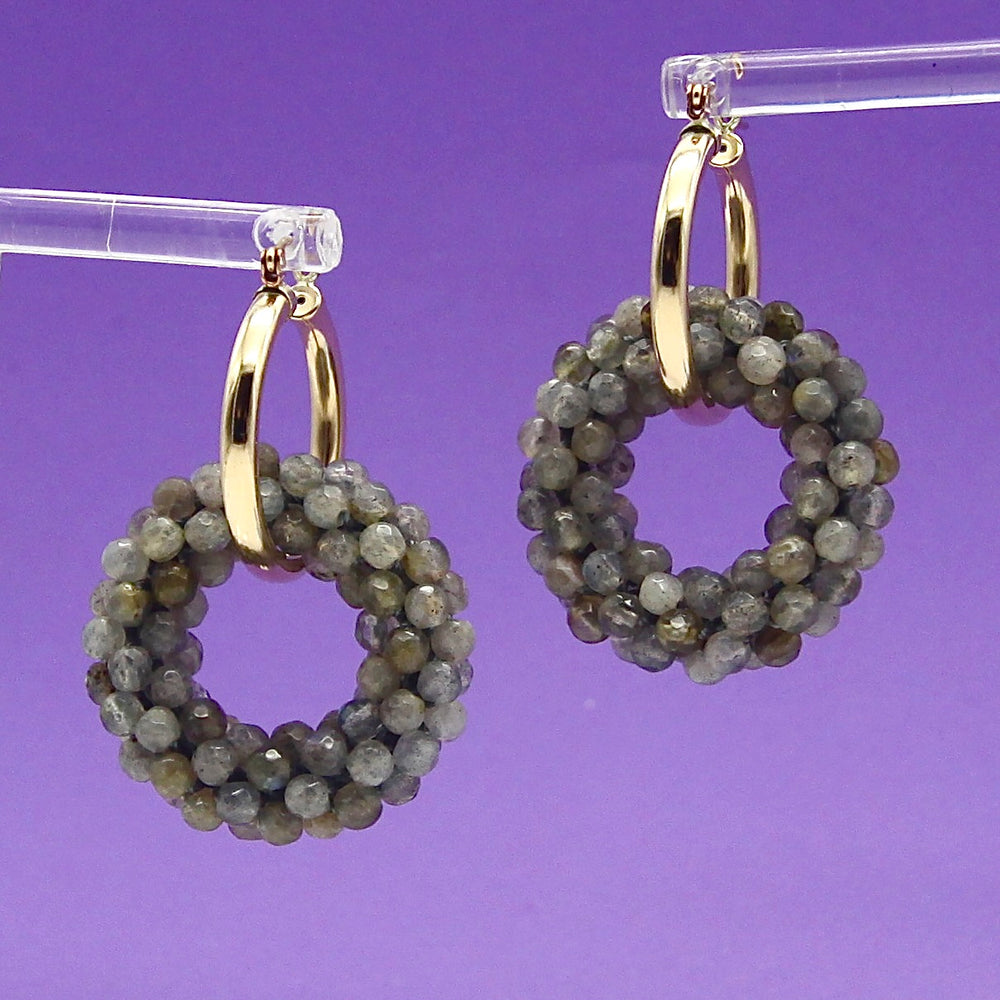 labradorite beaded gemstone earrings with gold hoops on purple background