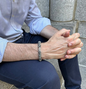 handmade beaded gemstone bracelet in grey jasper and sterling silver on male model