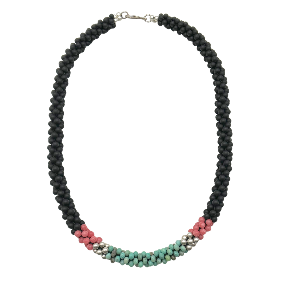handmade beaded gemstone necklace in black, pink and turquoise with a clasp on a white background