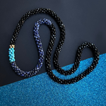 handmade beaded gemstone necklace in black onyx, blue aventurine and turquoise with gold accents