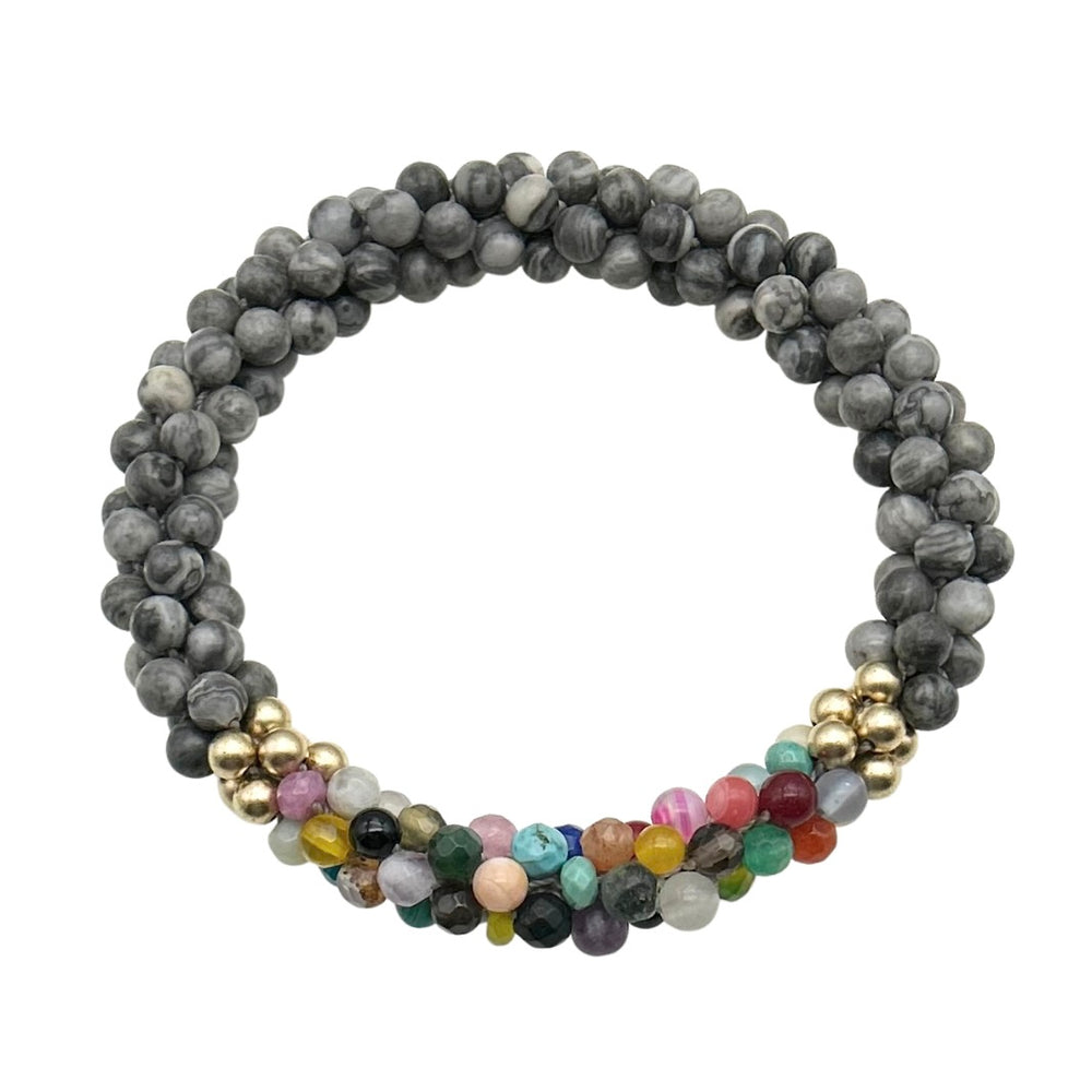 Handmade beaded gemstone bracelet in grey with a multicolor accent on a white background