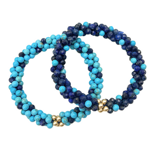 handmade beaded gemstone bracelets in light and dark blue polka dots and gold