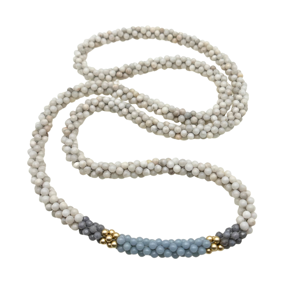 handmade beaded gemstone necklace in white, grey and light blue on a white background
