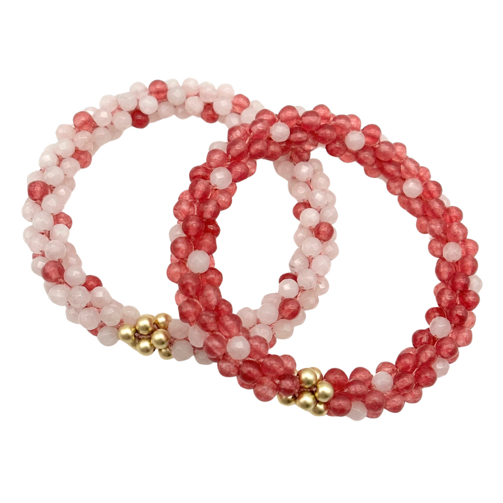 handmade beaded gemstone bracelets in light and dark pink polka dots and gold