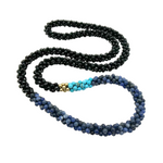 handmade beaded gemstone necklace in black onyx, blue aventurine and turquoise with gold accents