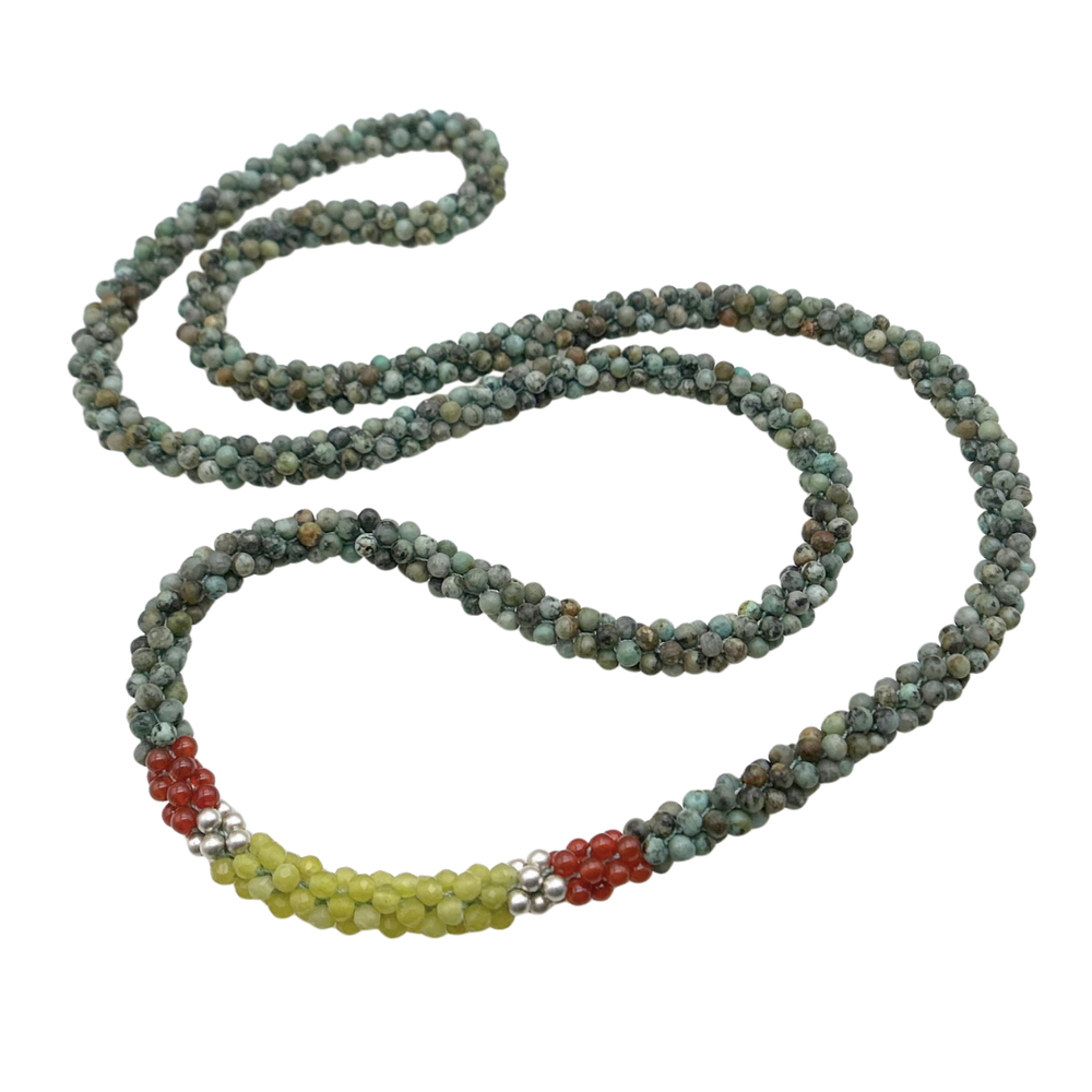 Handmade beaded gemstone necklace in turquoise, yellow and orange on a white background