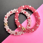 handmade beaded gemstone bracelets in light and dark pink polka dots and gold