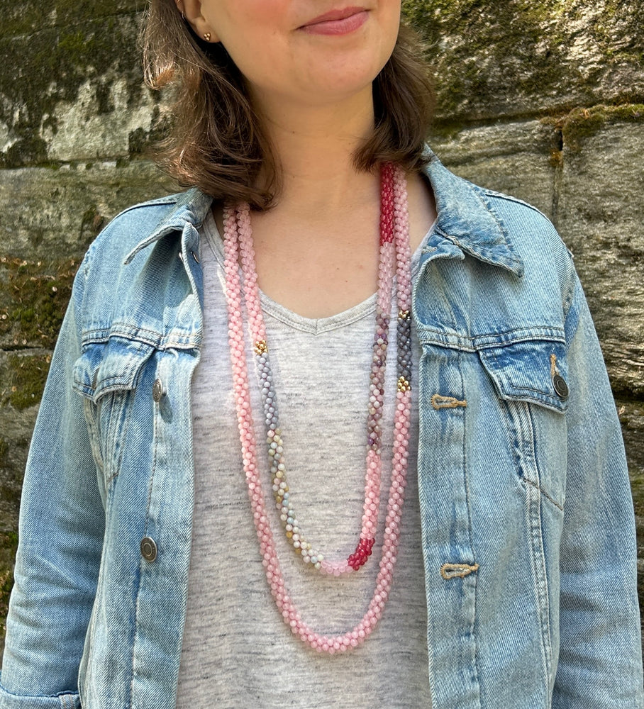two pink beaded gemstone necklaces on model