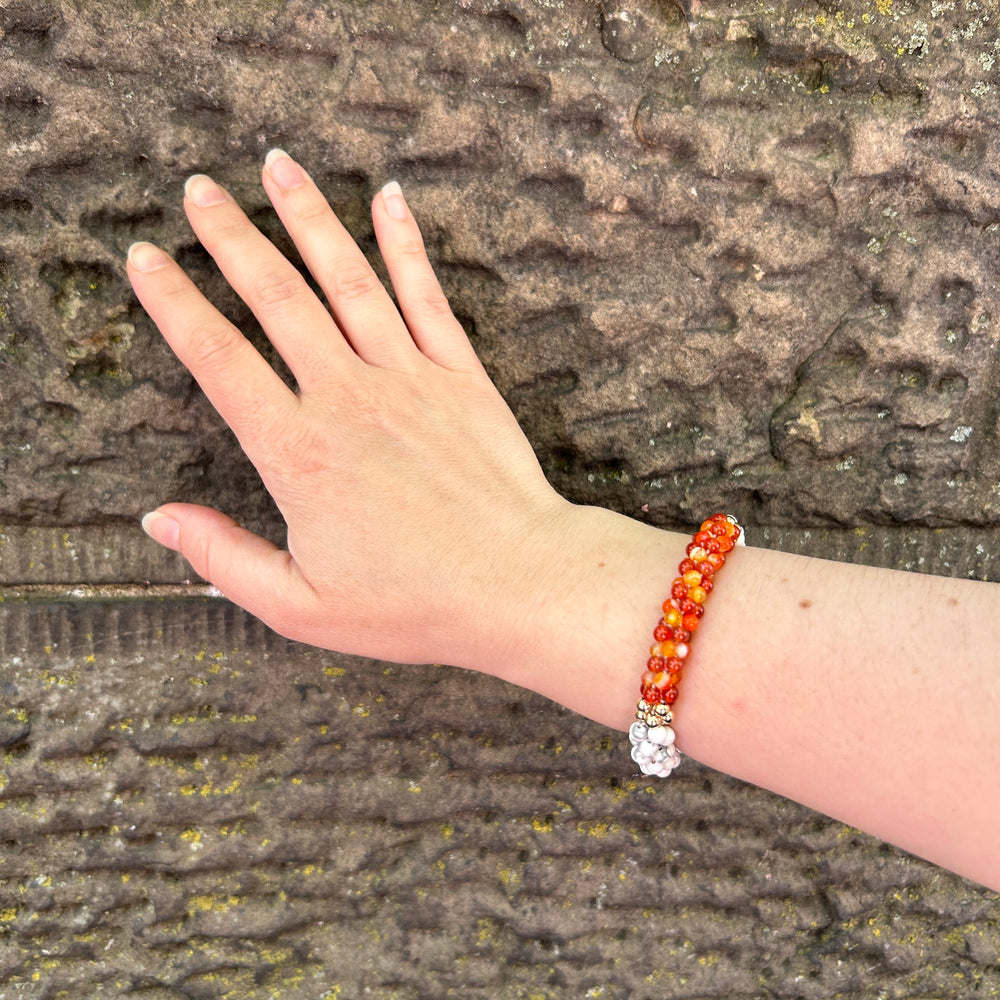 pride collection handmade beaded gemstone in white, orange and gold bracelet on wrist