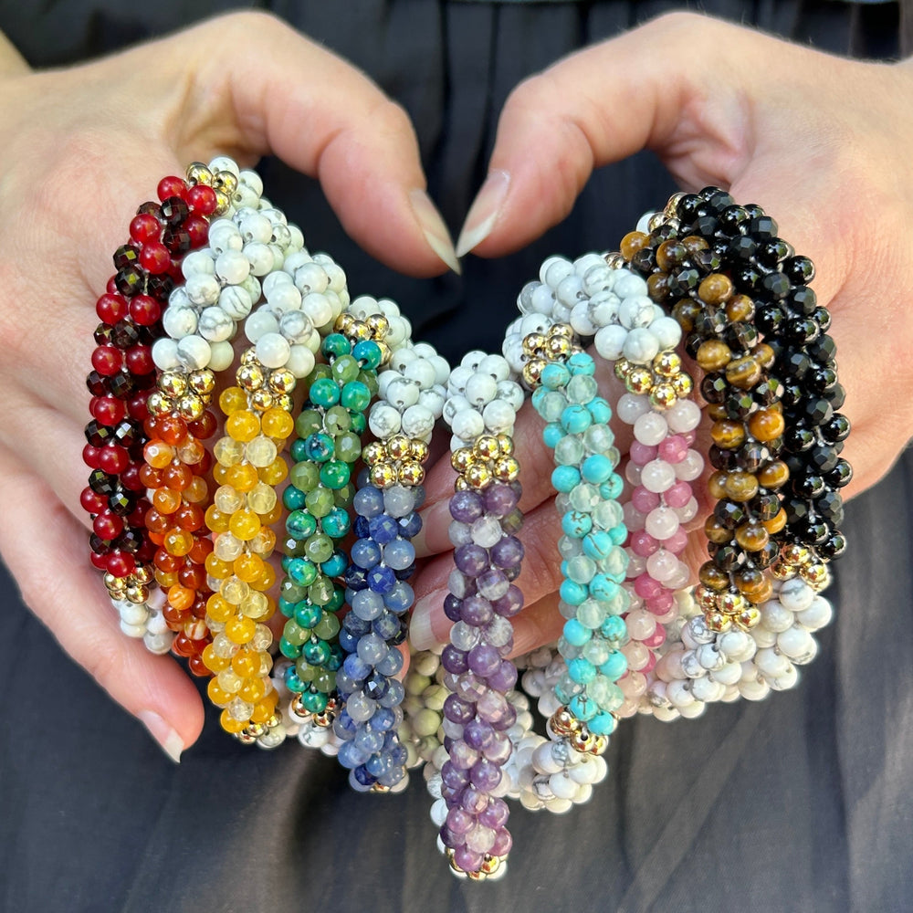 handmade beaded gemstone bracelets in a rainbow of colors for pride month