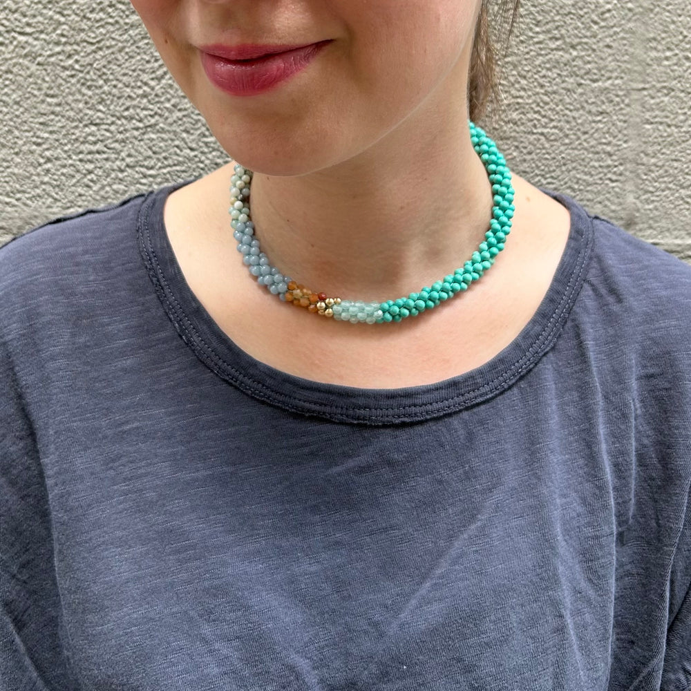 
            
                Load image into Gallery viewer, turquoise, aqua and gold color block handmade beaded gemstone choker on model
            
        