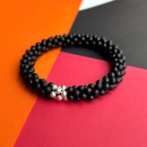 
            
                Load image into Gallery viewer, faceted matte black onyx and sterling silver beaded gemstone bracelet 
            
        