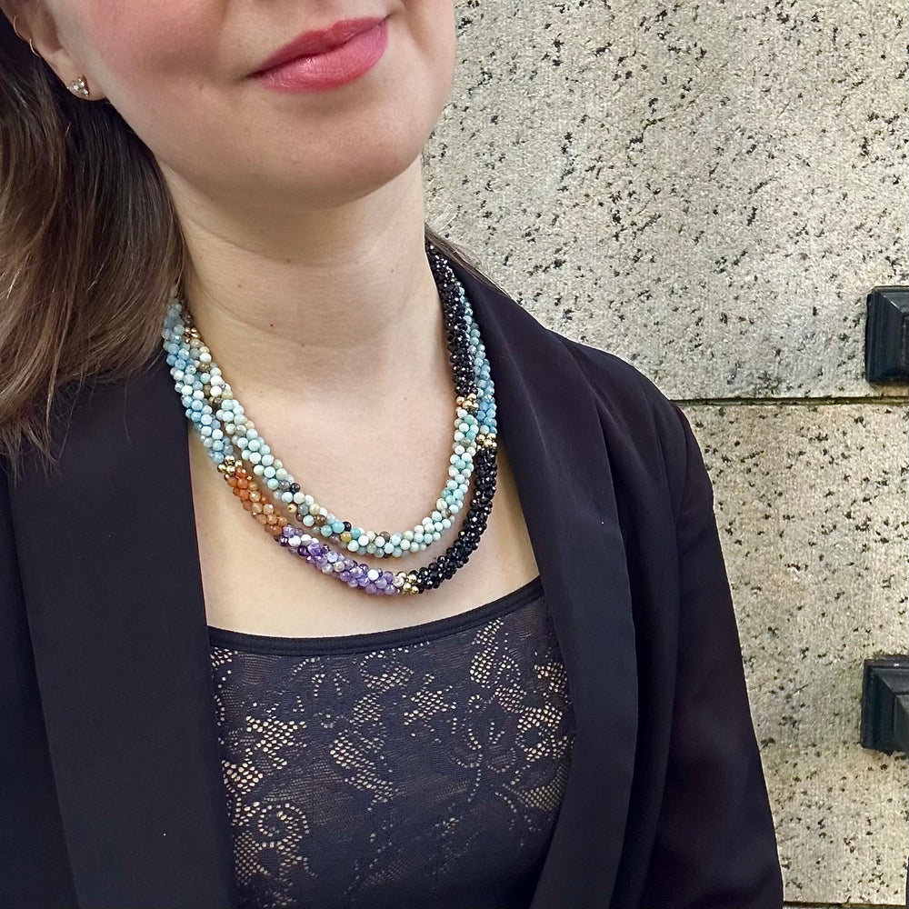 
            
                Load image into Gallery viewer, aquamarine, black spinel, amazonite and gold beaded gemstone necklace on model
            
        
