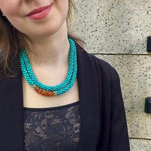 
            
                Load image into Gallery viewer, turquoise, carnelian and gold beaded gemstone necklace on model
            
        