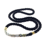 beaded gemstone necklace: black and white ombre, onyx and gold on white background