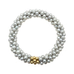 beaded pearl bracelet: grey pearl and gold beaded on white background