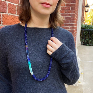 ocean blue ombre, lapis and gold beaded necklace on model