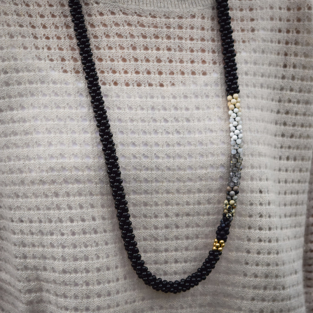 
            
                Load image into Gallery viewer, close up of black and white ombre necklace on model
            
        