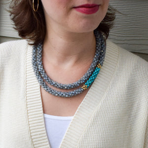 labradorite, turquoise and gold beaded necklace on model worn doubled