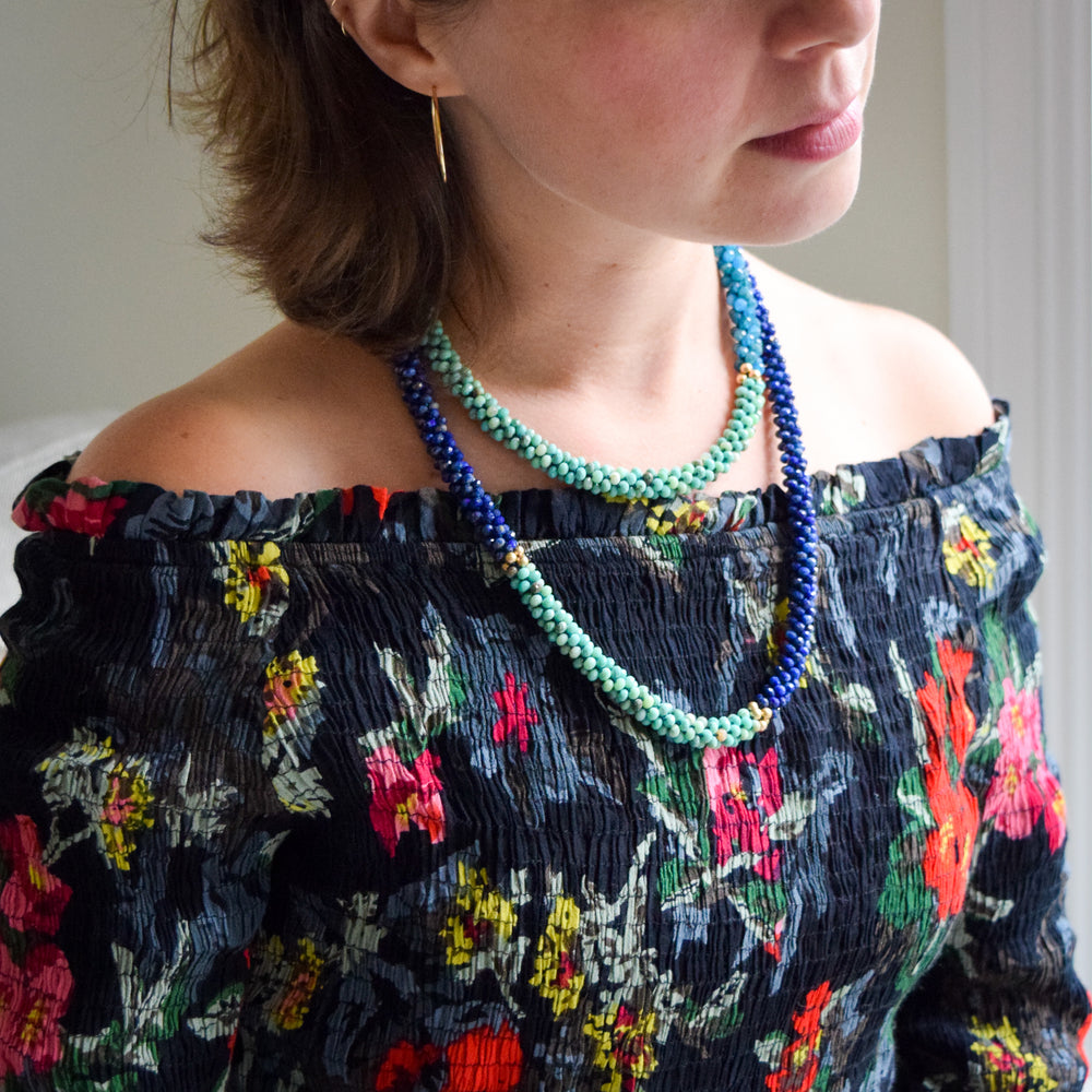 lapis, moss opal and gold necklace on model worn doubled