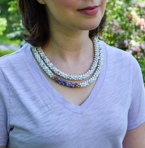 howlite, purple jade and gold beaded necklace on model worn doubled