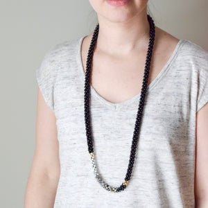 black and white ombre necklace on model