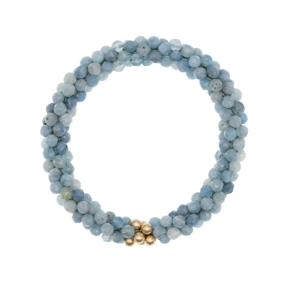 beaded gemstone bracelet: aquamarine and gold on white background