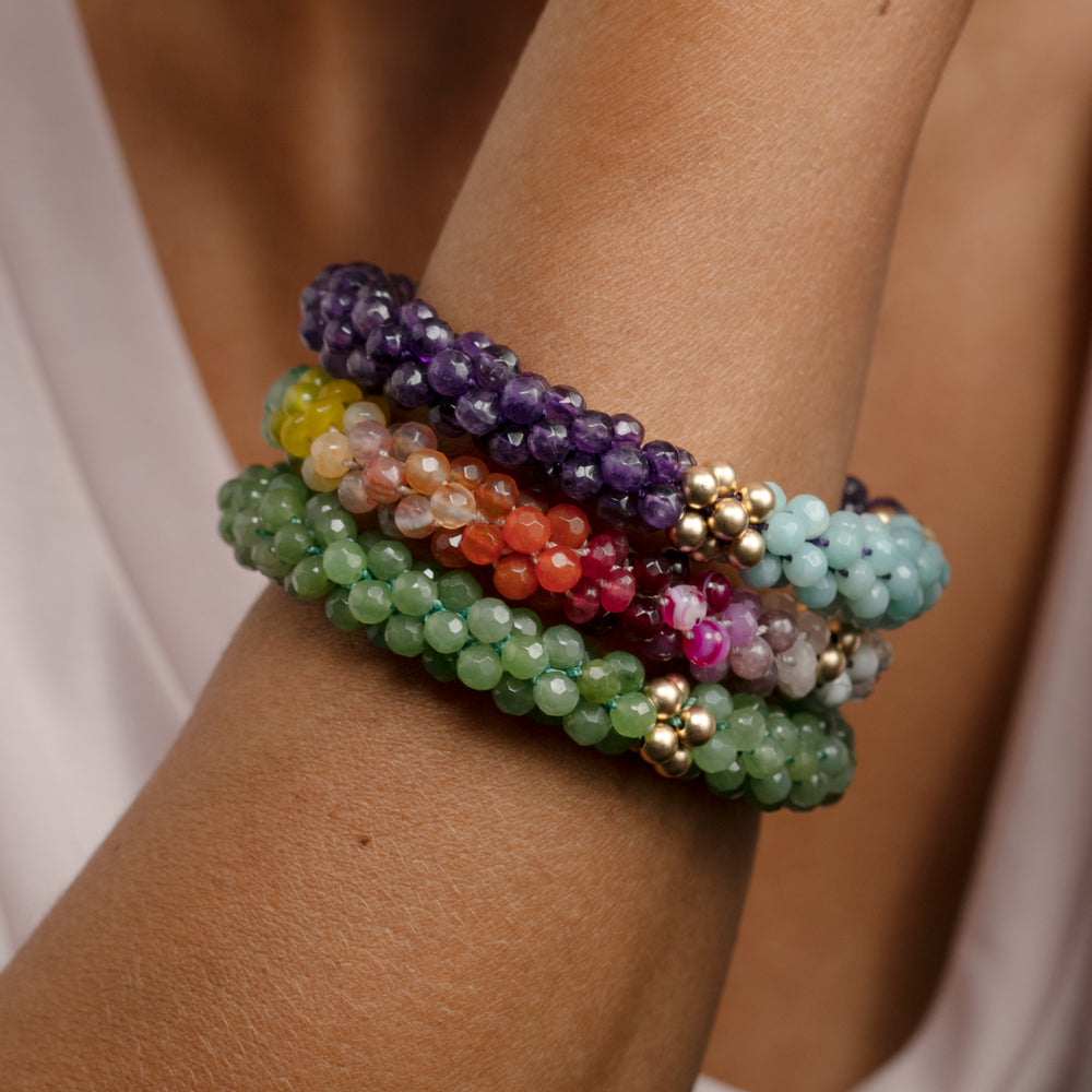 
            
                Load image into Gallery viewer, ultimate rainbow and gold beaded bracelet on model worn with two other bracelets
            
        