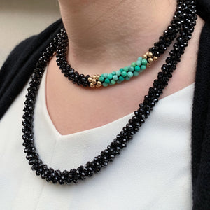 black spinel, moss opal and gold beaded necklace on model worn doubled