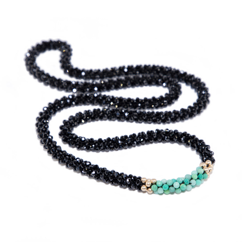 beaded gemstone necklace: black spinel, moss opal and gold on white background