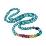 beaded gemstone necklace: rainbow, turquoise and gold on white background